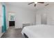 Bedroom with hardwood floors, ensuite bathroom and ceiling fan at 2444 Lobelia Dr, Lake Mary, FL 32746