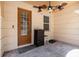 Inviting entrance with brick-look flooring, featuring a ceiling fan and dark brown locking mailbox at 2444 Lobelia Dr, Lake Mary, FL 32746