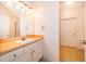 Bathroom featuring a vanity with cabinet storage, tiled flooring, decorative mirrors, and white walls at 12855 Madison Pointe Cir # 106, Orlando, FL 32821