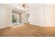 Bright living room featuring a ceiling fan, neutral carpet, crown molding, and sliding glass doors to the patio at 12855 Madison Pointe Cir # 106, Orlando, FL 32821