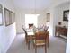 Dining room with beautiful wooden table and elegant decor at 320 Henley Cir, Davenport, FL 33896