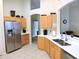 Bright kitchen featuring stainless steel appliances and generous cabinet space at 320 Henley Cir, Davenport, FL 33896