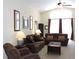 Comfortable living room with couches, chairs, and ample natural light at 320 Henley Cir, Davenport, FL 33896