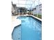 Sparkling screened-in pool perfect for relaxing and entertaining outdoors at 320 Henley Cir, Davenport, FL 33896