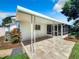 Covered patio with tile flooring and wrought iron accents at 648 Brechin Dr, Winter Park, FL 32792