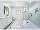 Elegant bathroom featuring marble shower, double vanity, and marble floors at 648 Brechin Dr, Winter Park, FL 32792