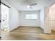 Bright bedroom with light wood floors and window at 648 Brechin Dr, Winter Park, FL 32792