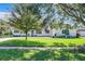 White brick ranch home with landscaped lawn and driveway at 648 Brechin Dr, Winter Park, FL 32792