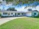 Front view of a renovated mid-century modern home at 648 Brechin Dr, Winter Park, FL 32792