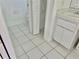 Bathroom with tile flooring and sink with cabinets at 5610 King James Ave, Leesburg, FL 34748