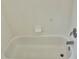 Close up of an empty bathtub with chrome fixtures and white tile at 5610 King James Ave, Leesburg, FL 34748