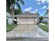 Charming single-story home with a well-manicured lawn and a spacious two-car garage and driveway at 5610 King James Ave, Leesburg, FL 34748