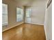 Living room with windows and hardwood floors at 5610 King James Ave, Leesburg, FL 34748