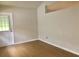 Spacious living room with light walls and wood-look flooring at 5610 King James Ave, Leesburg, FL 34748