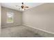 Bright bedroom with neutral walls and carpet flooring at 31722 Red Tail Blvd, Sorrento, FL 32776