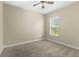 Well-lit bedroom with neutral walls and carpet flooring at 31722 Red Tail Blvd, Sorrento, FL 32776