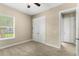 Bedroom with carpeted floors, double door closet and a view of the backyard at 31722 Red Tail Blvd, Sorrento, FL 32776