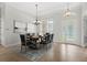 Elegant dining room featuring a chandelier and large windows at 31722 Red Tail Blvd, Sorrento, FL 32776