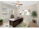 Home office featuring a large desk and neutral decor at 31722 Red Tail Blvd, Sorrento, FL 32776