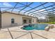 Inviting pool area with a screened enclosure and spacious patio at 31722 Red Tail Blvd, Sorrento, FL 32776