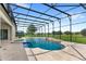 Inviting swimming pool and spa with a screened enclosure and a golf course view at 31722 Red Tail Blvd, Sorrento, FL 32776