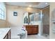 Bathroom with soaking tub, shower, and double sinks at 898 Arbormoor Pl, Lake Mary, FL 32746