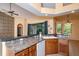 Kitchen with granite countertops and wood cabinets at 898 Arbormoor Pl, Lake Mary, FL 32746