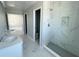 Elegant bathroom with double vanity, shower, and marble floors at 1189 Basalt Ln, Sanford, FL 32771
