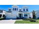 Charming two-story home featuring a landscaped yard, a two car garage, and neutral exterior paint at 1189 Basalt Ln, Sanford, FL 32771