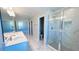 Bright bathroom featuring a double sink vanity, a glass shower, and tile flooring at 1189 Basalt Ln, Sanford, FL 32771