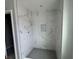 Large walk-in shower with marble-look tile and gray floor tile at 1189 Basalt Ln, Sanford, FL 32771