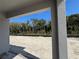 Unlandscaped backyard with sandy soil and distant tree line at 1193 Basalt Ln, Sanford, FL 32771