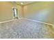 Empty bedroom with neutral walls and soft gray carpet at 1193 Basalt Ln, Sanford, FL 32771