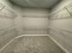 Walk-in closet with carpeted floor and metal shelving at 1193 Basalt Ln, Sanford, FL 32771