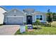 Charming single-Gathering home with a two-car garage and beautifully landscaped front yard at 1193 Basalt Ln, Sanford, FL 32771