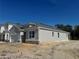 Side view of house with gray exterior and stone accents at 1193 Basalt Ln, Sanford, FL 32771
