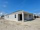 Rear view of house showing covered patio and windows at 1193 Basalt Ln, Sanford, FL 32771