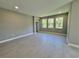 Living room with wood-look flooring, neutral walls, and lots of natural light at 1193 Basalt Ln, Sanford, FL 32771
