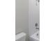 Bathroom with white tiling, neutral wall paint and modern fixtures at 1211 Teal Creek Dr, St Cloud, FL 34771