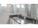 Modern bathroom with stone-look shower and dual sink vanity at 1211 Teal Creek Dr, St Cloud, FL 34771
