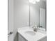 Bathroom featuring white countertop vanity with sink and large mirror at 1211 Teal Creek Dr, St Cloud, FL 34771