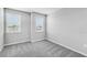 Bedroom boasting ample sunlight with carpeted floors and neutral wall paint at 1211 Teal Creek Dr, St Cloud, FL 34771