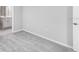 Bedroom featuring modern paint, carpeted floor and adjacent bathroom at 1211 Teal Creek Dr, St Cloud, FL 34771