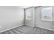 Bedroom featuring plush carpet, and sun-lit windows at 1211 Teal Creek Dr, St Cloud, FL 34771