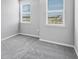 Cozy bedroom featuring plush carpet, and sun-lit windows at 1211 Teal Creek Dr, St Cloud, FL 34771