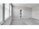 Spacious bedroom with carpeted floors and large windows overlooking the exterior at 1211 Teal Creek Dr, St Cloud, FL 34771