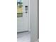 Contemporary entryway with white door and digital lock at 1211 Teal Creek Dr, St Cloud, FL 34771