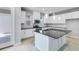 Modern kitchen featuring white cabinets, stainless steel appliances, and a dark countertops at 1211 Teal Creek Dr, St Cloud, FL 34771