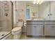 Well-maintained bathroom featuring a tiled shower and neutral color scheme at 16744 Sanctuary Dr, Winter Garden, FL 34787