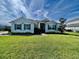 Charming one-story home with well-manicured lawn, inviting curb appeal, and beautiful landscaping at 16744 Sanctuary Dr, Winter Garden, FL 34787